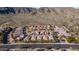 Drone shot highlights a home’s location and mountain views in a desert community with lush landscaping at 1123 W Thunderhill Dr, Phoenix, AZ 85045