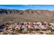 Home location highlighted in an aerial view of a desert community with lush landscaping and mountain views at 1123 W Thunderhill Dr, Phoenix, AZ 85045