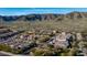 An aerial view showcases this beautiful community and custom homes nestled against the mountains at 1123 W Thunderhill Dr, Phoenix, AZ 85045
