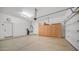 Spacious garage with epoxy flooring and ample storage cabinets at 1123 W Thunderhill Dr, Phoenix, AZ 85045