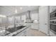 Close up of the kitchen island, stainless sink and faucet, and granite countertops at 1123 W Thunderhill Dr, Phoenix, AZ 85045