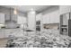 Kitchen island with granite countertops, stainless sink and faucet with pendant lighting above at 1123 W Thunderhill Dr, Phoenix, AZ 85045