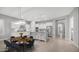 Bright kitchen features white cabinets, stainless steel appliances, and an island with bar seating at 1123 W Thunderhill Dr, Phoenix, AZ 85045