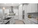 Bright kitchen featuring white cabinets, a granite countertop, subway tile backsplash and stainless appliances at 1123 W Thunderhill Dr, Phoenix, AZ 85045