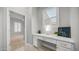 Well-lit office nook features a built-in desk, drawers, and a bright window at 1123 W Thunderhill Dr, Phoenix, AZ 85045