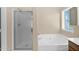 Relaxing bathroom featuring a soaking tub and a separate shower at 11306 E Rembrandt Ave, Mesa, AZ 85212