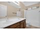 Bright bathroom featuring double sink vanity, and shower-tub combination at 11306 E Rembrandt Ave, Mesa, AZ 85212