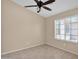 Cozy bedroom with a ceiling fan, neutral paint, and tile floors at 11306 E Rembrandt Ave, Mesa, AZ 85212