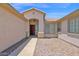 Inviting front entrance features a red door, tile roof, and desert landscaping at 11306 E Rembrandt Ave, Mesa, AZ 85212