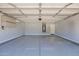 Clean, epoxy-floored two car garage with storage and climate control at 11306 E Rembrandt Ave, Mesa, AZ 85212