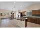 Open kitchen with granite countertops, stainless appliances, and a center island at 11306 E Rembrandt Ave, Mesa, AZ 85212