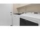 Functional laundry room equipped with modern washer and dryer appliances at 11306 E Rembrandt Ave, Mesa, AZ 85212