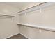 Organized walk-in closet with built-in shelving provides ample storage space at 11306 E Rembrandt Ave, Mesa, AZ 85212