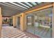 Covered outdoor patio with sliding glass doors that lead to the backyard swimming pool at 1131 N Cherry --, Mesa, AZ 85201