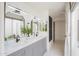 Bathroom with double sinks, modern fixtures, and a window offering natural light at 1131 N Cherry --, Mesa, AZ 85201