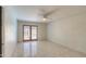 Bedroom featuring tiled floors, ceiling fan, and natural light at 1131 N Cherry --, Mesa, AZ 85201