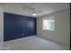 Spacious bedroom features a ceiling fan, a window, and neutral carpeting at 1131 N Cherry --, Mesa, AZ 85201