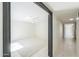 Spacious bedroom featuring neutral carpet, a ceiling fan, and access to a long hallway at 1131 N Cherry --, Mesa, AZ 85201