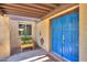 Charming entryway with a blue door, natural light, and a lovely planter filled with herbs and plants at 1131 N Cherry --, Mesa, AZ 85201