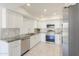 Modern kitchen featuring stainless steel appliances, white cabinets, and granite countertops at 1131 N Cherry --, Mesa, AZ 85201