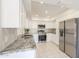 Stylish kitchen featuring stainless appliances, white cabinets, and granite countertops at 1131 N Cherry --, Mesa, AZ 85201