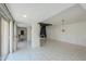 Bright living space featuring tile flooring, black beam ceilings, and access to other areas of the home at 1131 N Cherry --, Mesa, AZ 85201