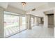 Bright, open living area with tiled floors and views of the outdoor pool and patio space at 1131 N Cherry --, Mesa, AZ 85201