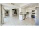 Open-concept layout with modern kitchen, dining, and living areas with abundant natural light at 1131 N Cherry --, Mesa, AZ 85201