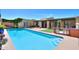 The long, sparkling backyard pool offers a refreshing escape, with a built-in barbecue nearby for outdoor entertaining at 1131 N Cherry --, Mesa, AZ 85201
