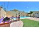 An outdoor kitchen area overlooks the beautiful pool; a perfect outdoor oasis at 1131 N Cherry --, Mesa, AZ 85201