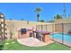 Inviting backyard featuring a well-maintained pool, built-in grill and bar, and ample space for entertaining at 1131 N Cherry --, Mesa, AZ 85201