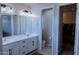 En suite bathroom with double sink vanity, toilet closet, and walk-in closet at 1183 S Tumbleweed Ln, Chandler, AZ 85286