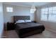 Comfortable bedroom features a plush bed and decorative lighting at 1183 S Tumbleweed Ln, Chandler, AZ 85286