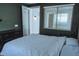 This bedroom has an exterior door and a large window with natural light at 1183 S Tumbleweed Ln, Chandler, AZ 85286