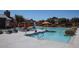 Community pool with lounge chairs and sun umbrellas at 1183 S Tumbleweed Ln, Chandler, AZ 85286