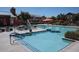Community pool with lounge chairs and sun umbrellas at 1183 S Tumbleweed Ln, Chandler, AZ 85286