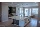 Spacious kitchen featuring an island with sink, modern appliances, and stylish pendant lighting at 1183 S Tumbleweed Ln, Chandler, AZ 85286