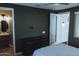 The main bedroom has dark green paint, a bathroom, and a door to the exterior at 1183 S Tumbleweed Ln, Chandler, AZ 85286