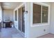 Covered balcony with BBQ gas grill and sliding glass doors at 1183 S Tumbleweed Ln, Chandler, AZ 85286