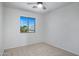Bright bedroom featuring neutral carpet, and a sunny window view at 1236 S Boulder St # C, Gilbert, AZ 85296