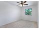 Cozy bedroom featuring neutral carpet, ceiling fan, and window at 1236 S Boulder St # C, Gilbert, AZ 85296