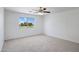 Spacious bedroom with a large window overlooking a community area at 1236 S Boulder St # C, Gilbert, AZ 85296