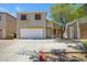 Two-story home with desert landscaping, inviting front entry, and two car garage at 1236 S Boulder St # C, Gilbert, AZ 85296