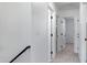 Clean and bright hallway with carpeted floors and white doors at 1236 S Boulder St # C, Gilbert, AZ 85296