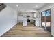 Open living room features bright kitchen, neutral paint and vinyl flooring at 1236 S Boulder St # C, Gilbert, AZ 85296