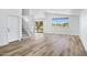 Open floor plan with hardwood floors leading to kitchen and backyard view at 1236 S Boulder St # C, Gilbert, AZ 85296