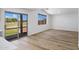 Living room boasts sliding glass doors to the backyard and neutral paint at 1236 S Boulder St # C, Gilbert, AZ 85296