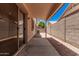 Back patio featuring ample sunlight, block wall, and access from inside at 125 N 22Nd Pl # 128, Mesa, AZ 85213