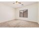 Cozy bedroom featuring carpet, a window with blinds, and ample natural light at 125 N 22Nd Pl # 128, Mesa, AZ 85213