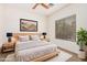 Cozy bedroom with a plush rug, serene artwork, natural light and neutral tones that create a calming atmosphere at 125 N 22Nd Pl # 128, Mesa, AZ 85213